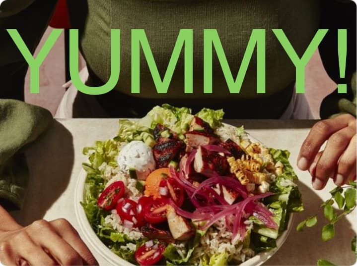 Fresh meal on a table with 'YUMMY!' text.