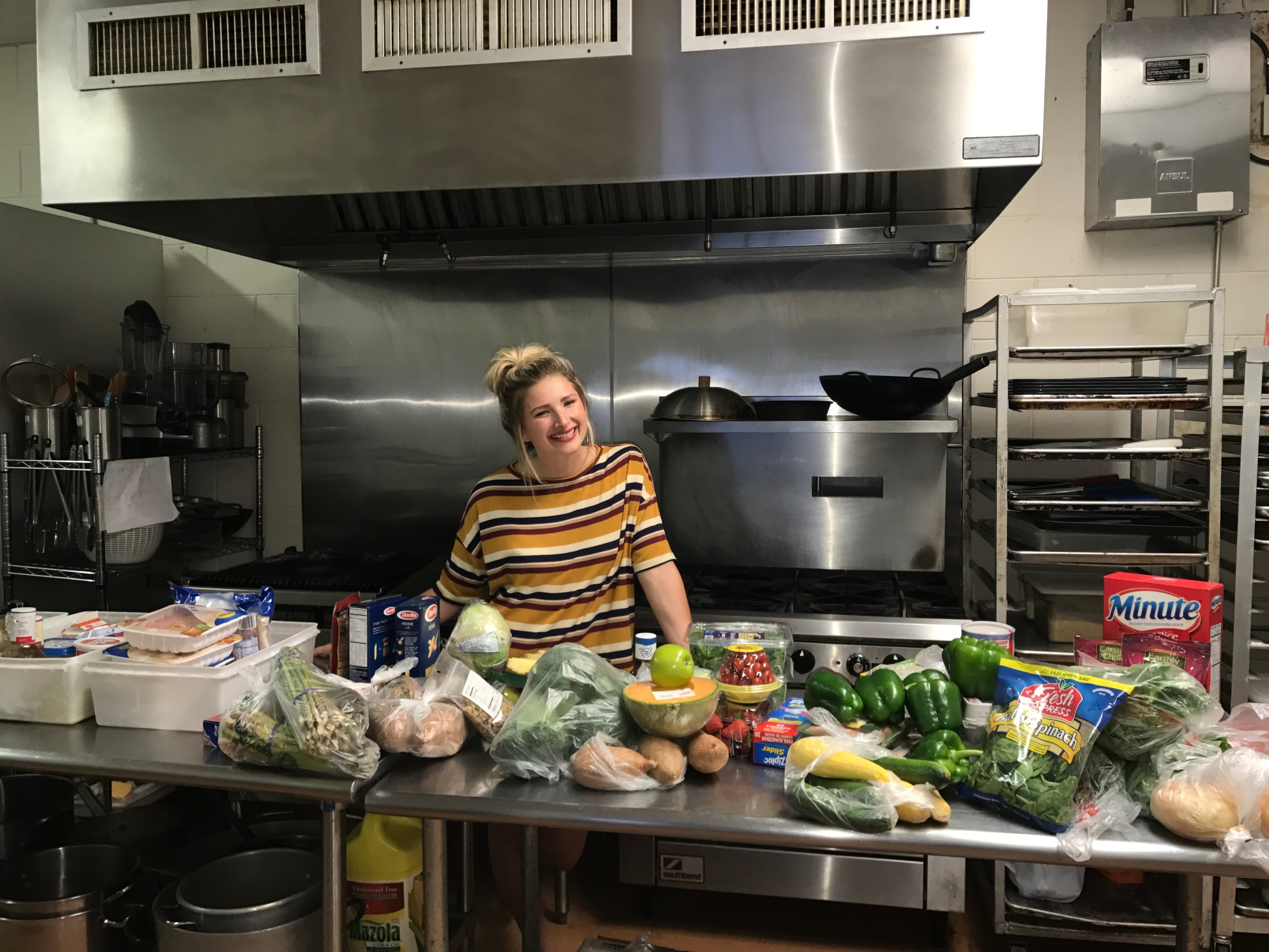 Allie in the kitchen with ingredients for Tough Cookies’ first orders
