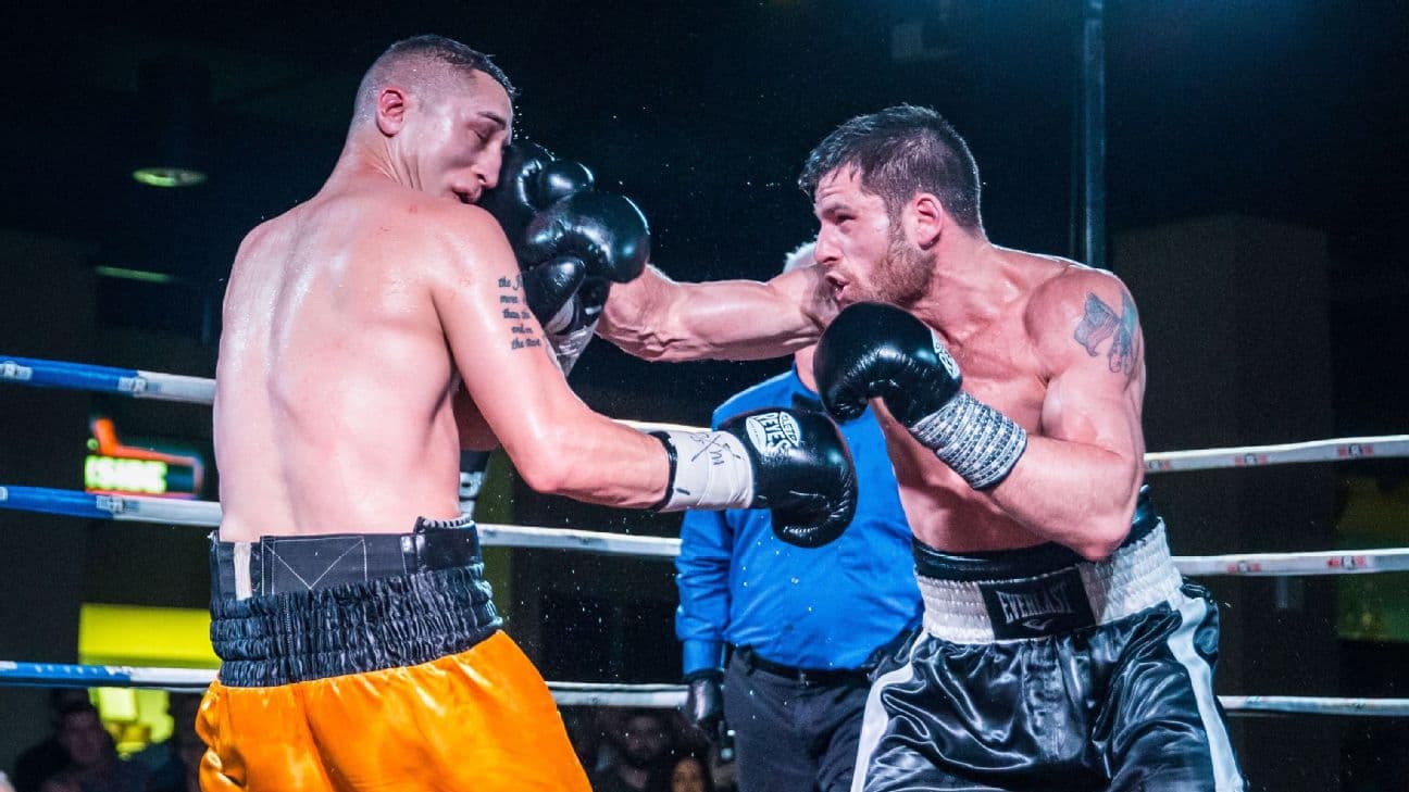 Mark DeLuca boxing in the ring